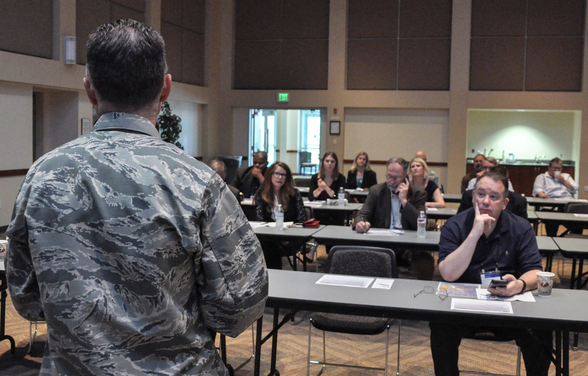 Col. Darren Buck, 460th Space Wing vice commander, speaks to members of the 2015 National Conference of State Legislatures June 4, 2015, at Buckley Air Force Base, Colo. The legislators learned about buffer-zone land issues, public-public public-private initiatives, and observed how Buckley AFB is successfully integrating with the State of Colorado to benefit both the base’s and the state’s populations. (U.S. Air Force photo by Tech. Sgt. Nicholas Rau/Released)