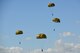 German soldiers parachute over the historic La Fiere drop zone near Sainte Mere Eglise, Normandy, France, June 7, 2015, to commemorate the 71st Anniversary of D-Day. More than 380 U.S. service members from Europe and affiliated D-Day historical units participated in the 71st Anniversary air drop as part of Joint Task Force D-Day 71. The task force, based in Sainte Mere Eglise, France, is supporting local events across Normandy, from June 2-8, 2015, to commemorate the selfless actions by all the Allies on D-Day that continue to resonate 71 years later.(U.S. Air Force photo/Senior Airman Nicole Sikorski)