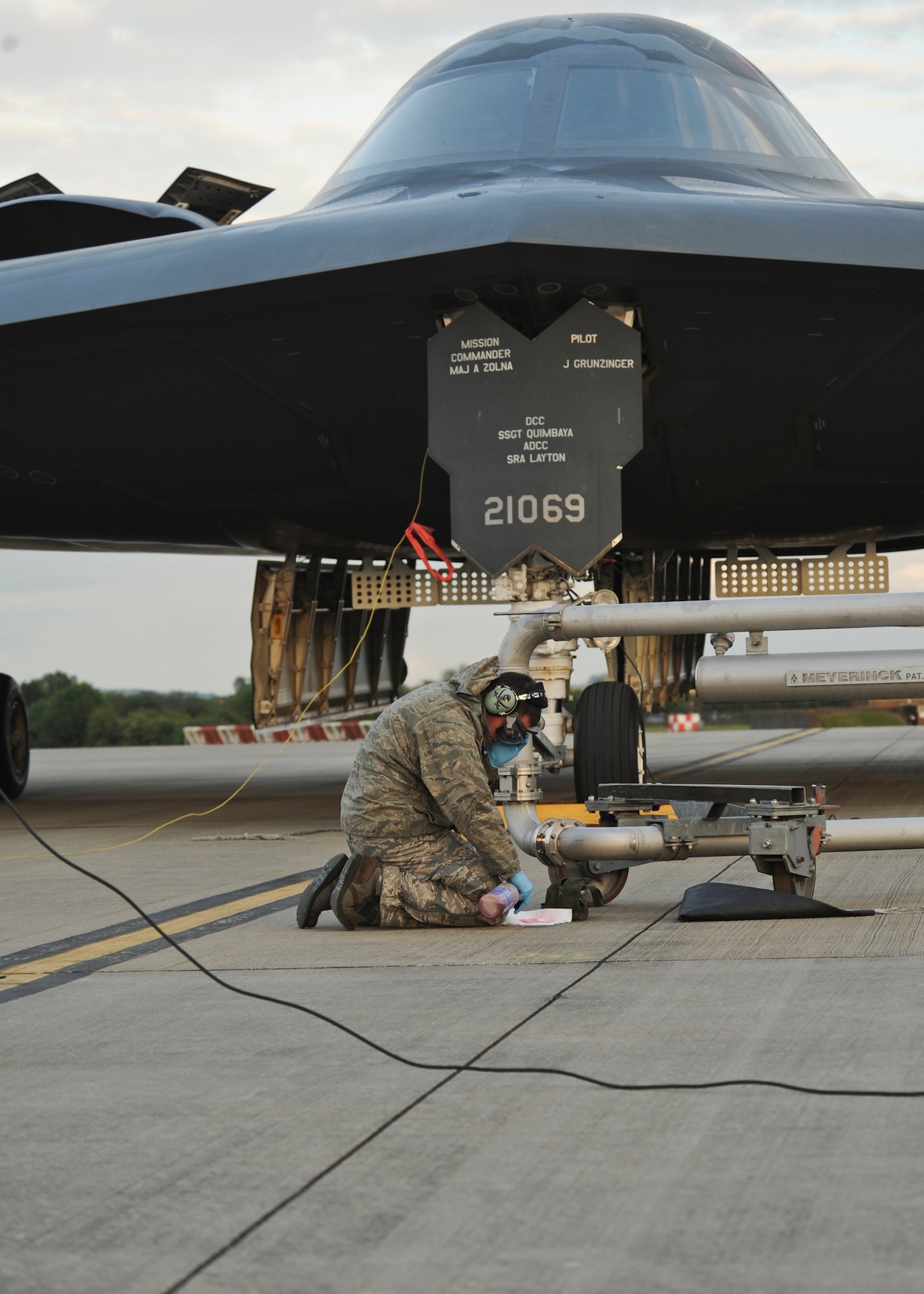 A 509th Aircraft Maintenance Squadron crew chief preps a B-2 Spirit for refueling at Royal Air Force Fairford, England, June 8, 2015. A hot-pit refueling was conducted after the B-2 Spirit landed on RAF Fairford, England, showcasing the capability of the aircraft to forward deploy and deliver a conventional and nuclear force anytime and anywhere. (U.S. Air Force photo/Capt. Christopher Mesnard)