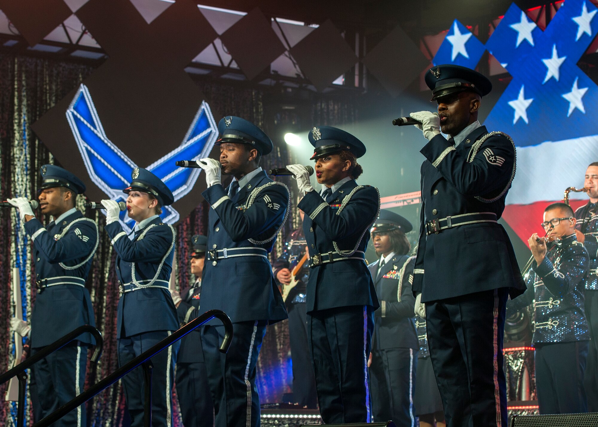A Tops In Blue ensemble performs during their Freedom’s Song World Tour at the Emerald Coast Convention Center, June 6 in Fort Walton Beach, Fla. They were among 37 Airmen selected for the special unit based on their ability to entertain.  The TIB team is also the “road crew” for each show.  Managed by seven technical personnel, they are responsible for the transporting and setting up more than 65,000 pounds of stage equipment.  TIB’s mission is to provide entertainment to military personnel and their families at home and abroad. (U.S. Air Force photo/Ilka Cole)