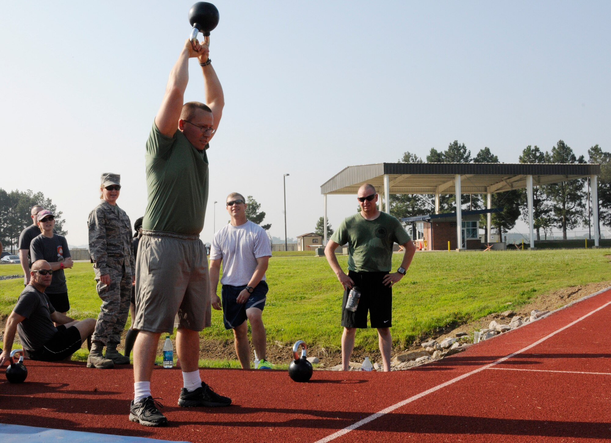 Members of the 188th Wing gathered together to compete in multiple physical challenges for Wingman day 2015 held June 7, at Ebbing Air National Guard Base, Fort Smith, Ark. Wingman Day is designed to encourage Airmen to build and foster positive relationships in their work areas and throughout the wing. The day’s events consisted of a 1.5 mile run, volleyball, horseshoes, a mile relay, free-throw competition, golf pitching and a casting contest. Brig. Gen. James Vogel, Arkansas Air National Guard commander, and Col. Bobbi Doorenbos, 188th Wing commander, presented awards to team winners at the conclusion of the day’s events. (U.S. Air National Guard photo by Staff Sgt. Hannah Dickerson/Released)