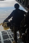 A U.S. Airman from the 38th Rescue Squadron out of Moody Air Force Base, Ga., moves forward to jump from a C-130 Hercules aircraft assigned to the Wyoming Air National Guard's 153rd Airlift Wing during a mission for the exercise Angel Thunder 2015 near Davis-Monthan Air Force Base, Ariz., June 7, 2015. Angel Thunder is the largest and most realistic joint service, multinational, interagency combat search and rescue exercise designed to provide training for personnel recovery assets using a variety of scenarios to simulate deployment conditions and contingencies. Personnel recovery forces will train through the full spectrum of personnel recovery capabilities with ground recovery personnel, air assets, Special Forces teams and federal agents. (U.S. Air National Guard photo by Tech. Sgt. John Galvin/Released)