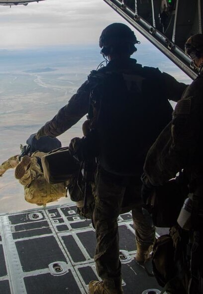 A U.S. Airman from the 38th Rescue Squadron out of Moody Air Force Base, Ga., moves forward to jump from a C-130 Hercules aircraft assigned to the Wyoming Air National Guard's 153rd Airlift Wing during a mission for the exercise Angel Thunder 2015 near Davis-Monthan Air Force Base, Ariz., June 7, 2015. Angel Thunder is the largest and most realistic joint service, multinational, interagency combat search and rescue exercise designed to provide training for personnel recovery assets using a variety of scenarios to simulate deployment conditions and contingencies. Personnel recovery forces will train through the full spectrum of personnel recovery capabilities with ground recovery personnel, air assets, Special Forces teams and federal agents. (U.S. Air National Guard photo by Tech. Sgt. John Galvin/Released)