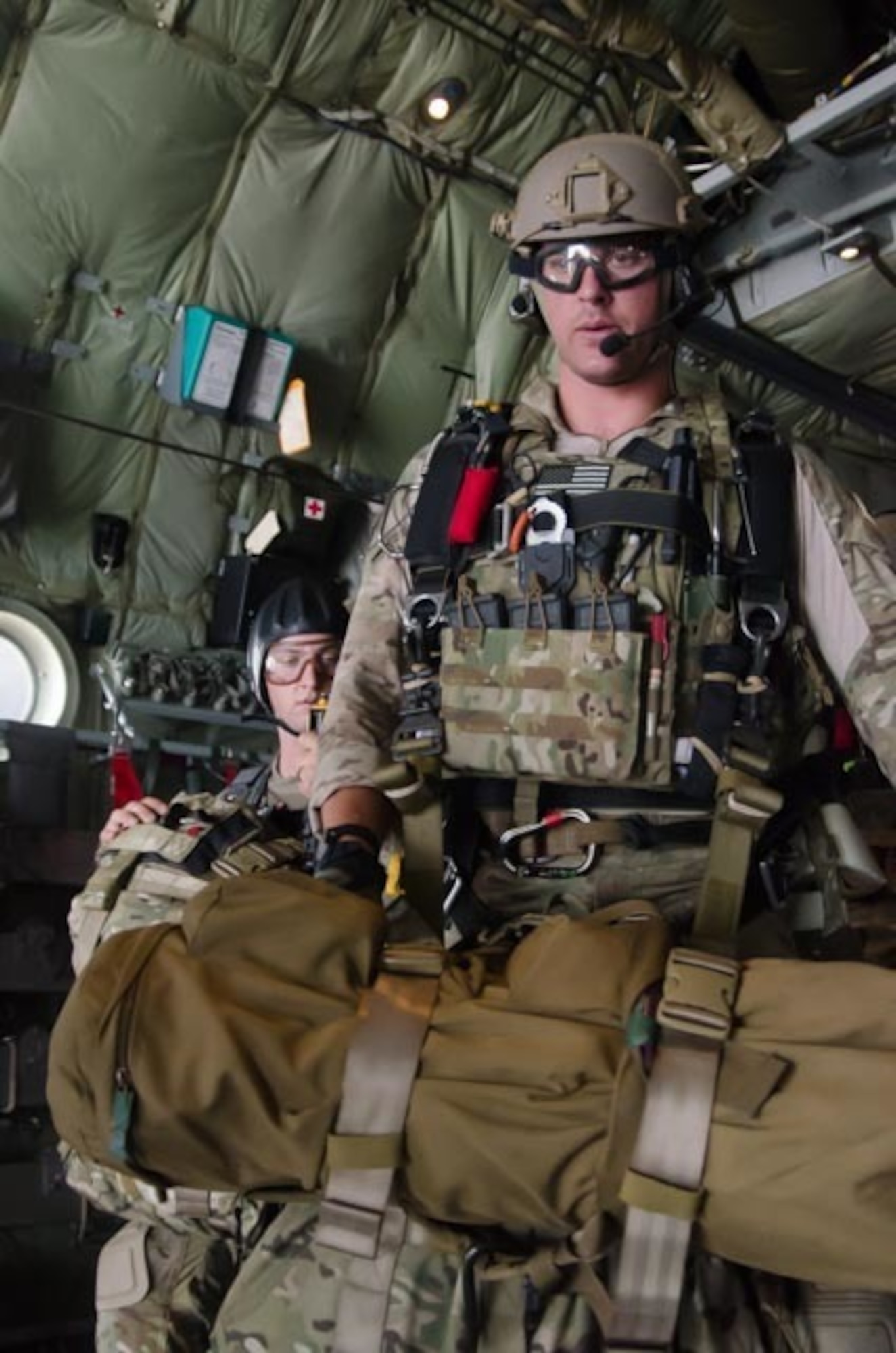 A U.S. Airman from the 38th Rescue Squadron out of Moody Air Force Base, Ga., moves forward to jump from a C-130 Hercules aircraft assigned to the Wyoming Air National Guard's 153rd Airlift Wing during a mission for the exercise Angel Thunder 2015 near Davis-Monthan Air Force Base, Ariz., June 7, 2015. Angel Thunder is the largest and most realistic joint service, multinational, interagency combat search and rescue exercise designed to provide training for personnel recovery assets using a variety of scenarios to simulate deployment conditions and contingencies. Personnel recovery forces will train through the full spectrum of personnel recovery capabilities with ground recovery personnel, air assets, Special Forces teams and federal agents. (U.S. Air National Guard photo by Tech. Sgt. John Galvin/Released)
