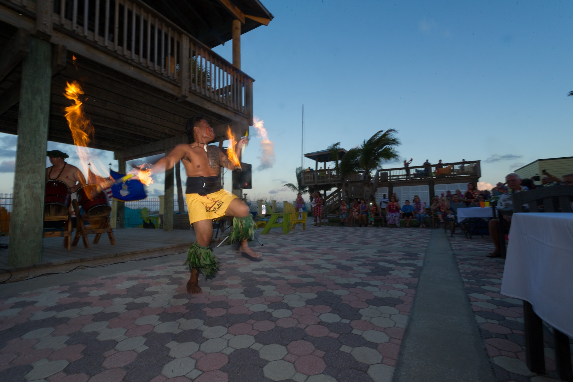 Via “VJ” Tiumalu, Jr., current Senior Division World Fireknife dancing champion, performs for the 45th Space Wing Luau event at the Beach House May 29, 2015, at Patrick Air Force Base, Fla. The art of fireknife dancing includes spinning, catching and even balancing flaming, sharpened knives on callused feet. (U.S. Air Force photo/Cory Long) (Released)
