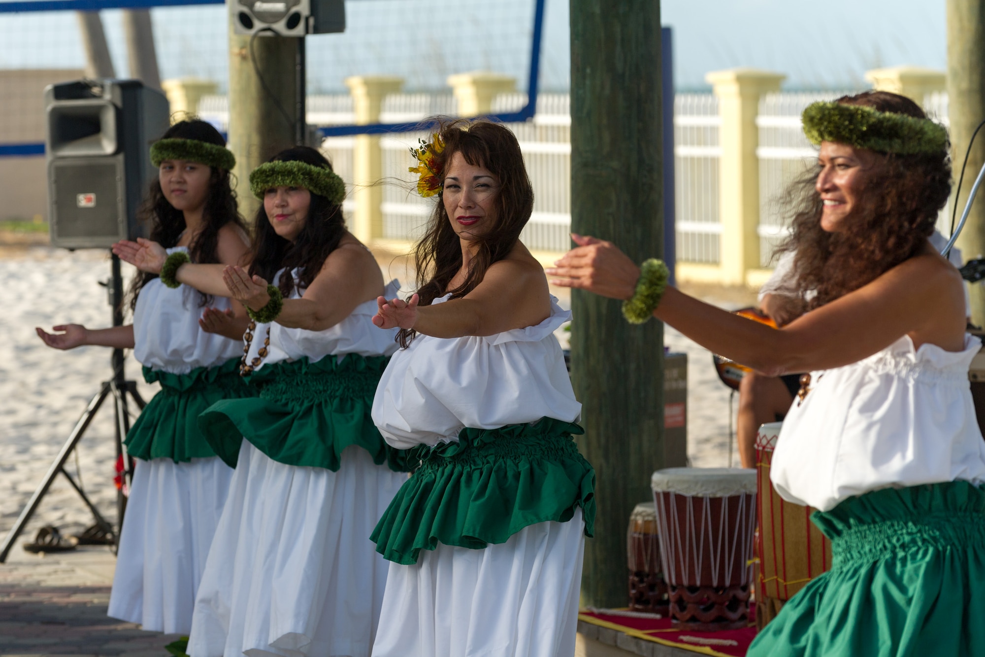 Kumu Pu’uwai Silva, instructor for the Space Coast Hula School, second from the right, performs an ‘Auana, modern hula, for the Asian American and Pacific Islander Heritage Luau May 29, 2015, held at the Beach House at Patrick Air Force Base, Fla. The Luau is part of an observance held annually from May 1 - 31 in celebration of Asian American and Pacific Islander Heritage Month. (U.S. Air Force photo/Cory Long) (Released)
