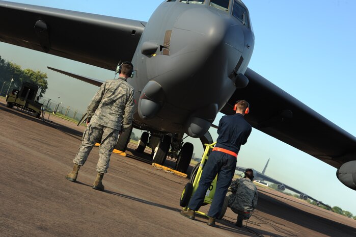Staff Sgt. Taylor Granger and Senior Airman Zachary Silvers, 5th Aircraft Maintenance Squadron crew chiefs, check the control operations on a B-52H Stratofortress at Royal Air Force Fairford, England, June 8, 2015. This was the first flight ground crew members launched in support of Saber Strike 15. Saber Strike 15 provides training opportunities in the Baltic region in preparation for NATO Response Force certification. U.S. Strategic Command bomber missions provide unique opportunities to integrate and train with Geographic Combatant Commands and the United States’ allies and partners in joint and coalition operations and exercises. (U.S. Air Force photo/Capt. Christopher Mesnard) 