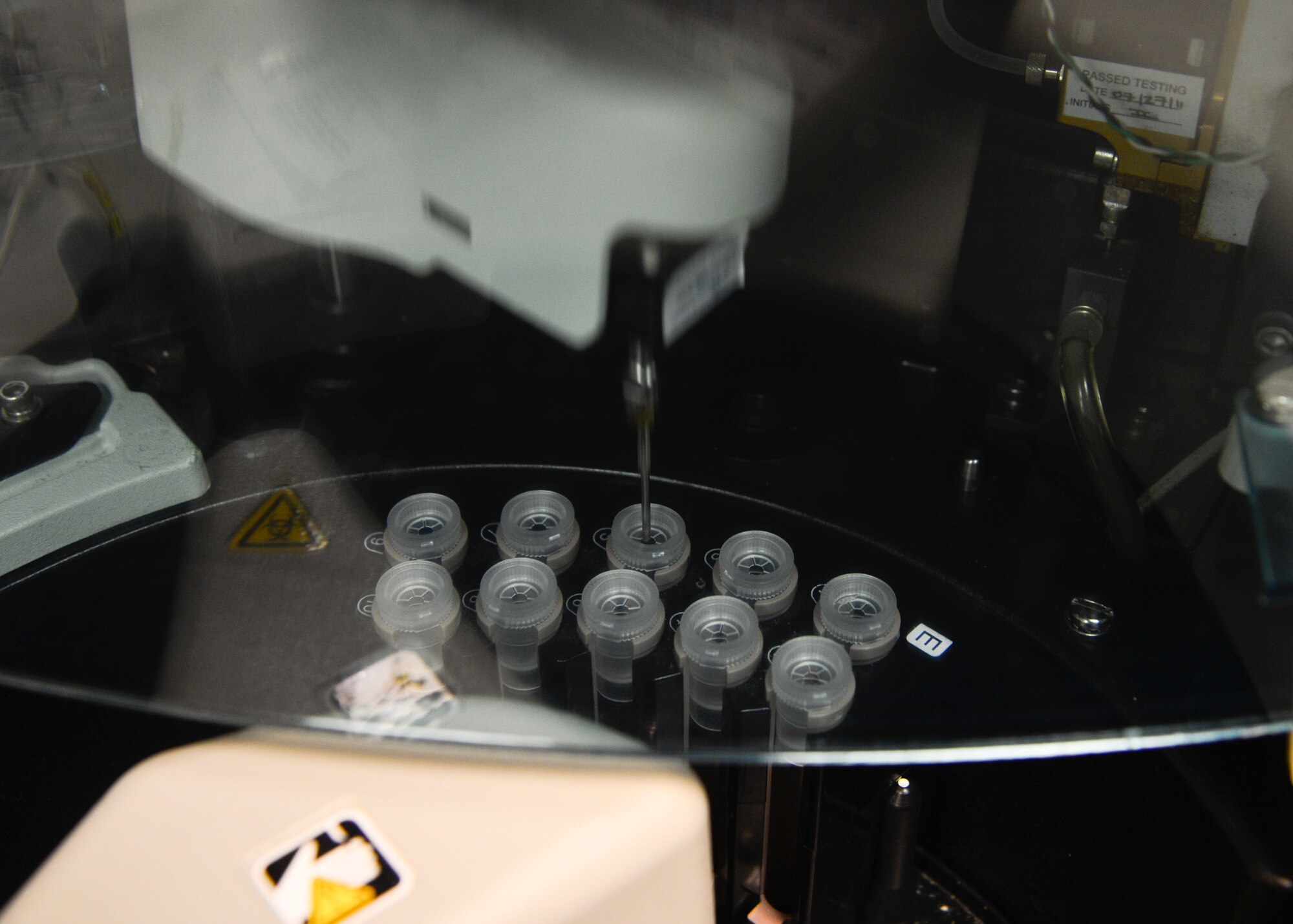 A Siemens Dimension EXL 200 machine samples a College of American Pathologists (CAP) prostate-specific antigen survey June 5, 2015, at the Clinical Laboratory on Dover Air Force Base, Del. The machine ran 10 different tests as part of the survey to ensure that it is producing accurate results. (U.S. Air Force photo/Airman 1st Class William Johnson)
