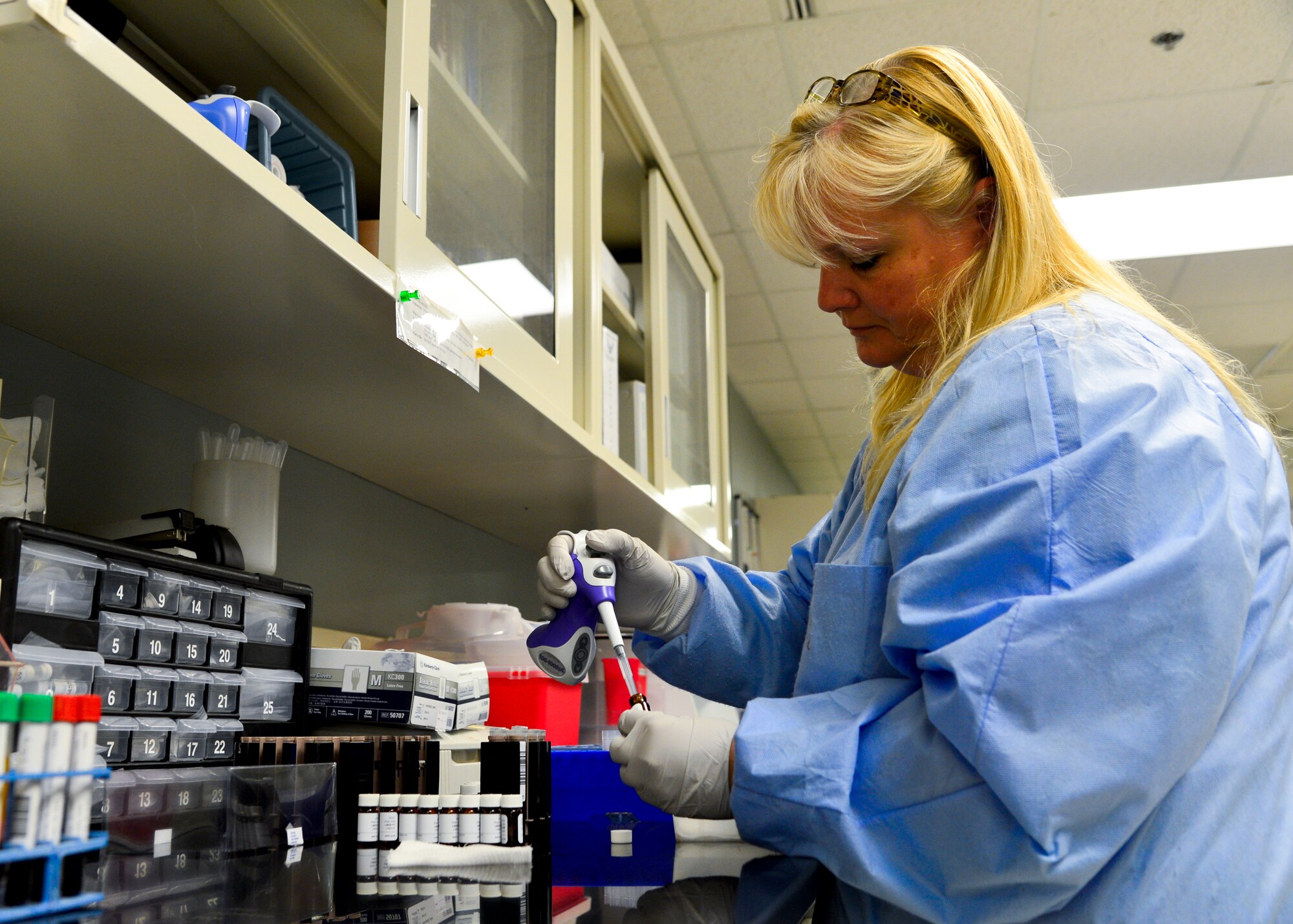Raeann Rivera, 436th Medical Support Squadron chemistry supervisor, prepares to run a College of American Pathologists (CAP) prostate-specific antigen survey June 5, 2015, at the Clinical Laboratory on Dover Air Force Base, Del. The survey results are reported back to CAP to ensure accuracy of laboratory processes and equipment. (U.S. Air Force photo/Airman 1st Class William Johnson)