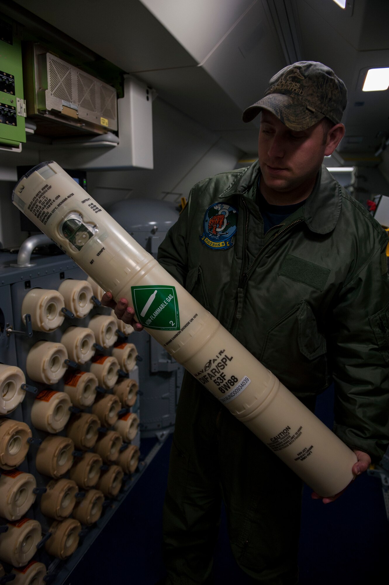 A sailor from the U.S. Navy Patrol Squadron Eight from Naval Air Station Jacksonville, Fla., holds up a sonobuoy in a Boeing P-8 Poseidon maritime surveillance aircraft during a BALTOPS 2015 mission on the flightline of Spangdahlem Air Base, Germany, June 9, 2015. Sailors aboard the aircraft use sonobuoys to conduct anti-submarine warfare and underwater acoustic research. Seventeen NATO and partner nations are participating in the 43rd iteration of the multinational maritime exercise BALTOPS 2015 in Poland, Sweden, Germany, and throughout the Baltic Sea. (U.S. Air Force photo by Airman 1st Class Timothy Kim/Released)