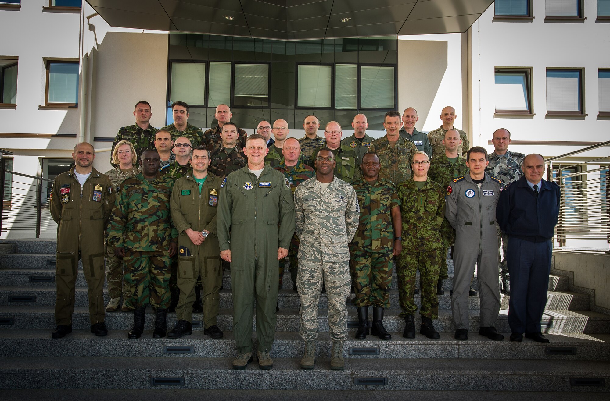 Gen. Frank Gorenc, U.S. Air Forces in Europe and Air Forces Africa commander, and Chief Master Sgt. James Davis, USAFE-AFAFRICA command chief, pose for a group photo with senior enlisted and officers from multiple countries throughout Europe and Africa during a the Professional Military Development Symposium at Ramstein Air Base, Germany, June 4, 2015. This inaugural PMD course was designed to bring allied and partner nations together to exchange ideas and best practices with the goal of improving their militaries. (U.S. Air Force photo/ Tech. Sgt. Ryan Crane)
