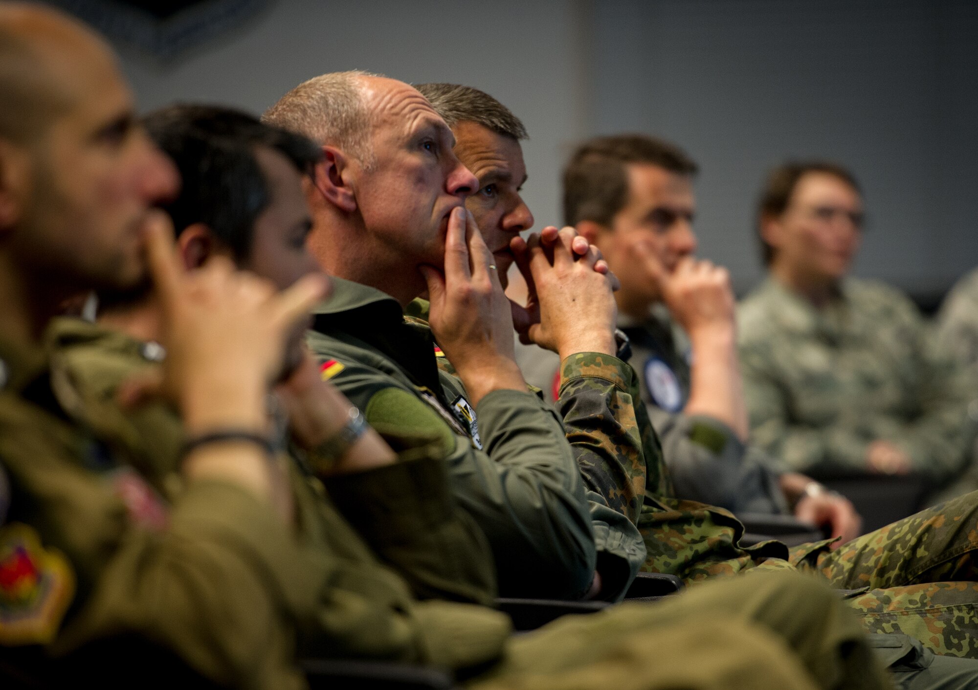 Senior enlisted and officers from multiple countries throughout Europe and Africa listen to a brief about the non-commissioned officer professional military education course during a the Professional Military Development Symposium at Ramstein Air Base, Germany, June 3, 2015. This inaugural PMD course was designed to bring allied and partner nations together to exchange ideas and best practices with the goal of improving their militaries. (U.S. Air Force photo/ Tech. Sgt. Ryan Crane)