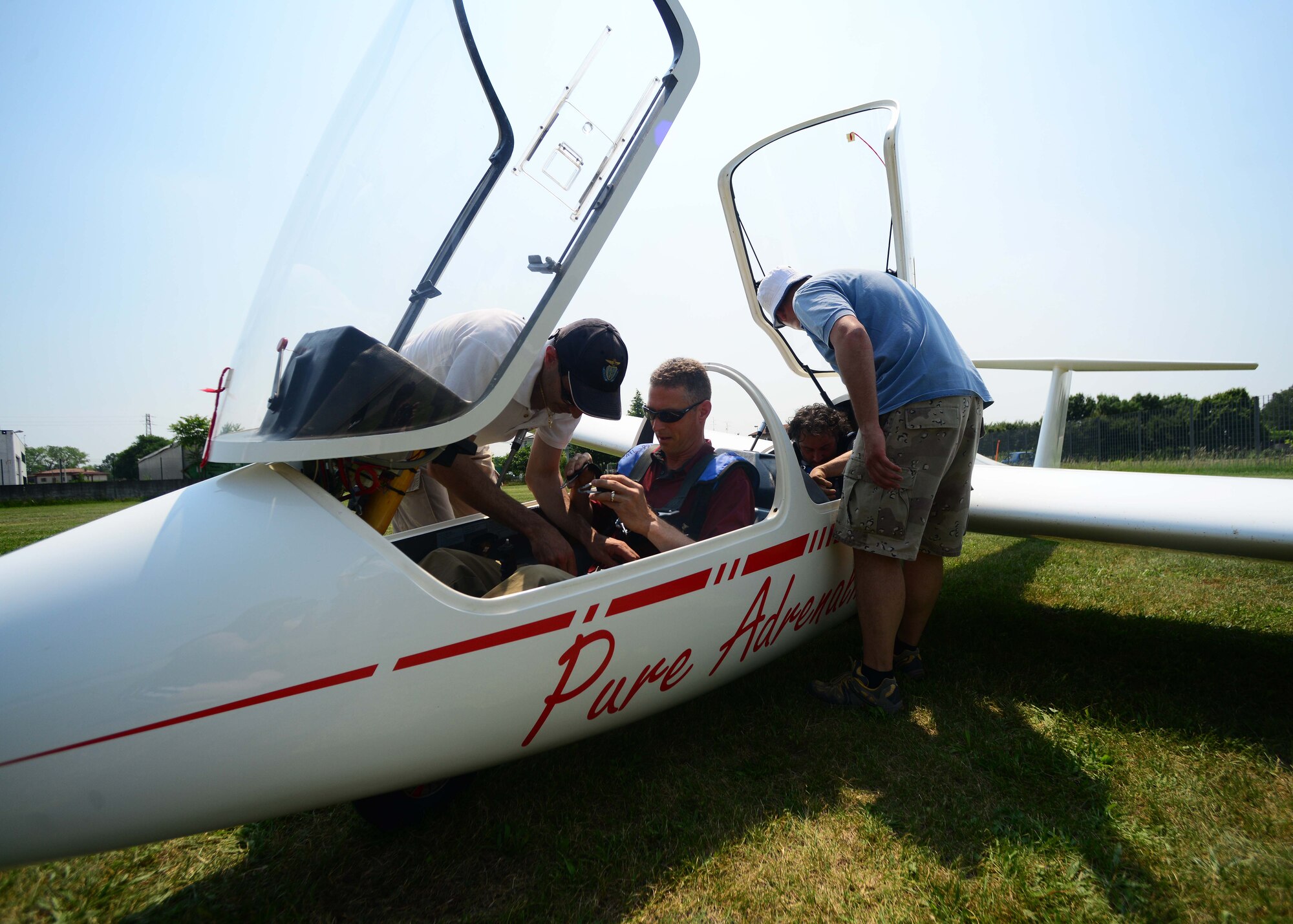 U.S. Air Force Col. Gregory Kreuder, 31st Fighter Wing vice commander, prepares to take off in a glider at La Comina Airfield, June 6, 2015, in Pordenone, Italy. The incentive flight event was hosted by the Honorary Squadron Commander’s Association, which is an organization that represents Italian nationals who show an interest in fostering and displaying positive relationships between both U.S. and Italy. (U.S. Air Force photo by Airman 1st Class Deana Heitzman/Released)  