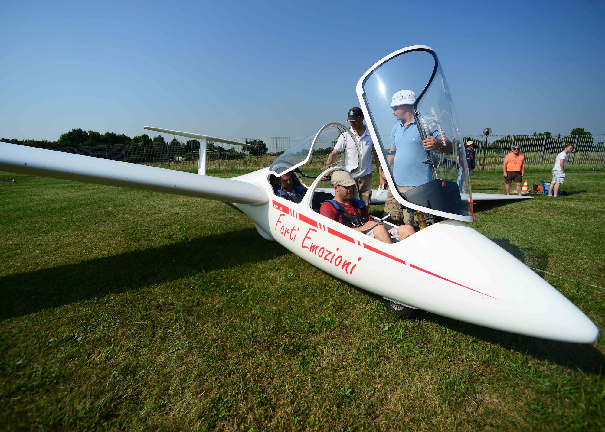 U.S. Air Force Staff Sgt. Miles Madrid, 31st Aerospace Medical Squadron medical standards management technician, prepares to take off in a glider at La Comina Airfield, June 6, 2015, in Pordenone, Italy. Airmen were hand-selected by their unit leaders to participate in incentive flights hosted by the Honorary Squadron Commander’s Association. (U.S. Air Force photo by Airman 1st Class Deana Heitzman/Released)