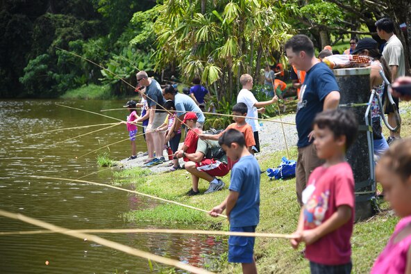 Children and parents from Joint Base Pearl Harbor-Hickam participate in the 16th Annual Friends of Hickam Keiki Fishing Tournament  at the Ho`omaluhia Botanical Gardens in Kaneohe, June 5, 2015. More than 100 members from JBPHH and their children participated in the free fishing tournament hosted by "Friends of Hickam," an organization seeking to support, promote, and foster strong community relations with military families. (U.S. Air Force photo by Tech. Sgt. Aaron Oelrich/Released)