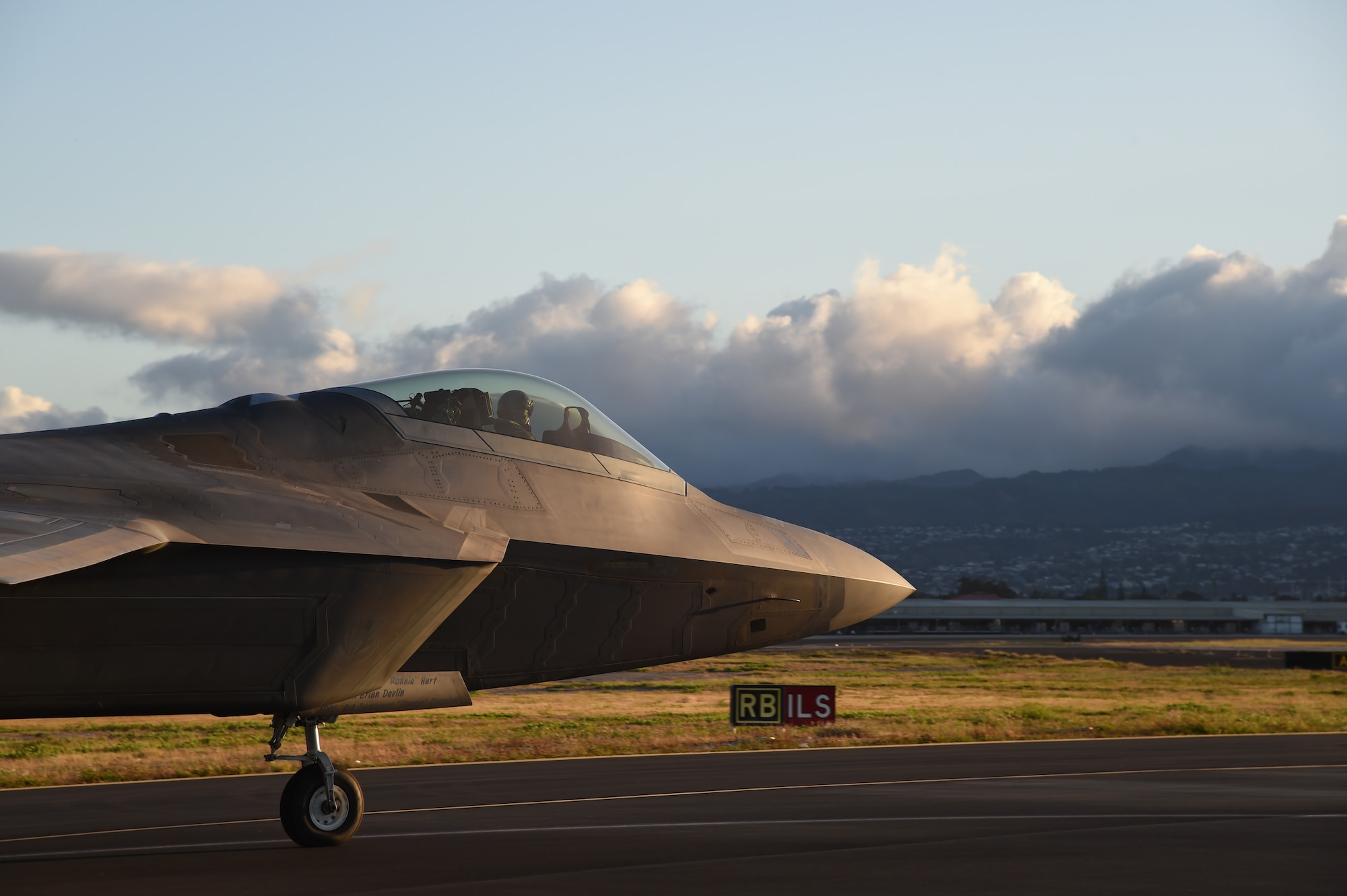 An F-22 Raptor pilot from the 19th Fighter Squadron taxies after completing an end of runway inspection on Joint Base Pearl Harbor-Hickam, Hawaii, June 6, 2015. This was the first aircraft to take off during a record breaking 62 sorties in one day by the Hawaii Air National Guard’s 199th Fighter Squadron and the 19th Fighter Squadron. (U.S. Air Force photo by Tech. Sgt. Aaron Oelrich/Released)    