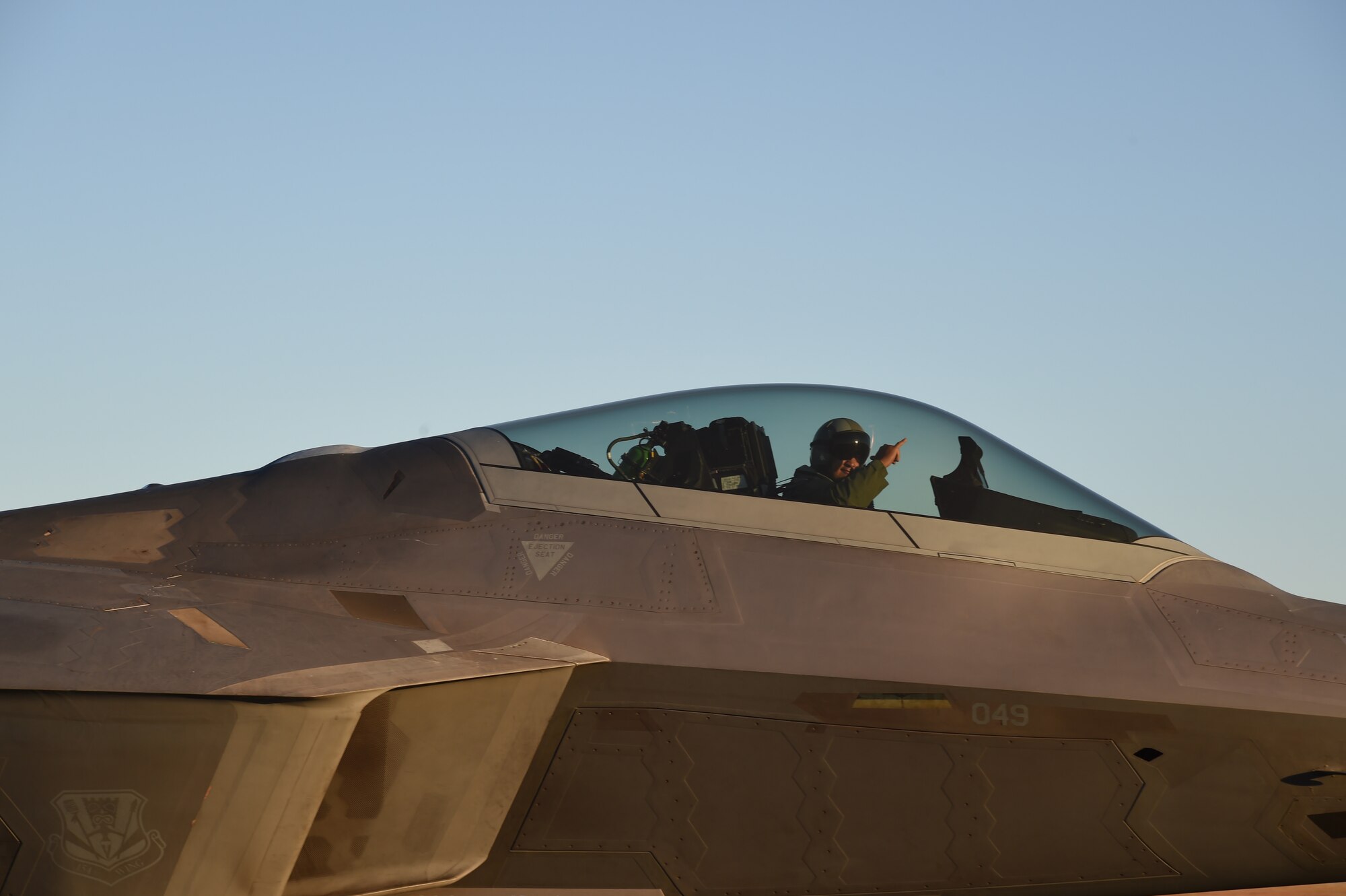 An F-22 Raptor pilot from the 19th Fighter Squadron taxies after completing an end of runway inspection on Joint Base Pearl Harbor-Hickam, Hawaii, June 6, 2015. This was the first aircraft to take off during a record breaking 62 sorties in one day by the Hawaii Air National Guard’s 199th Fighter Squadron and the 19th Fighter Squadron. (U.S. Air Force photo by Tech. Sgt. Aaron Oelrich/Released) 