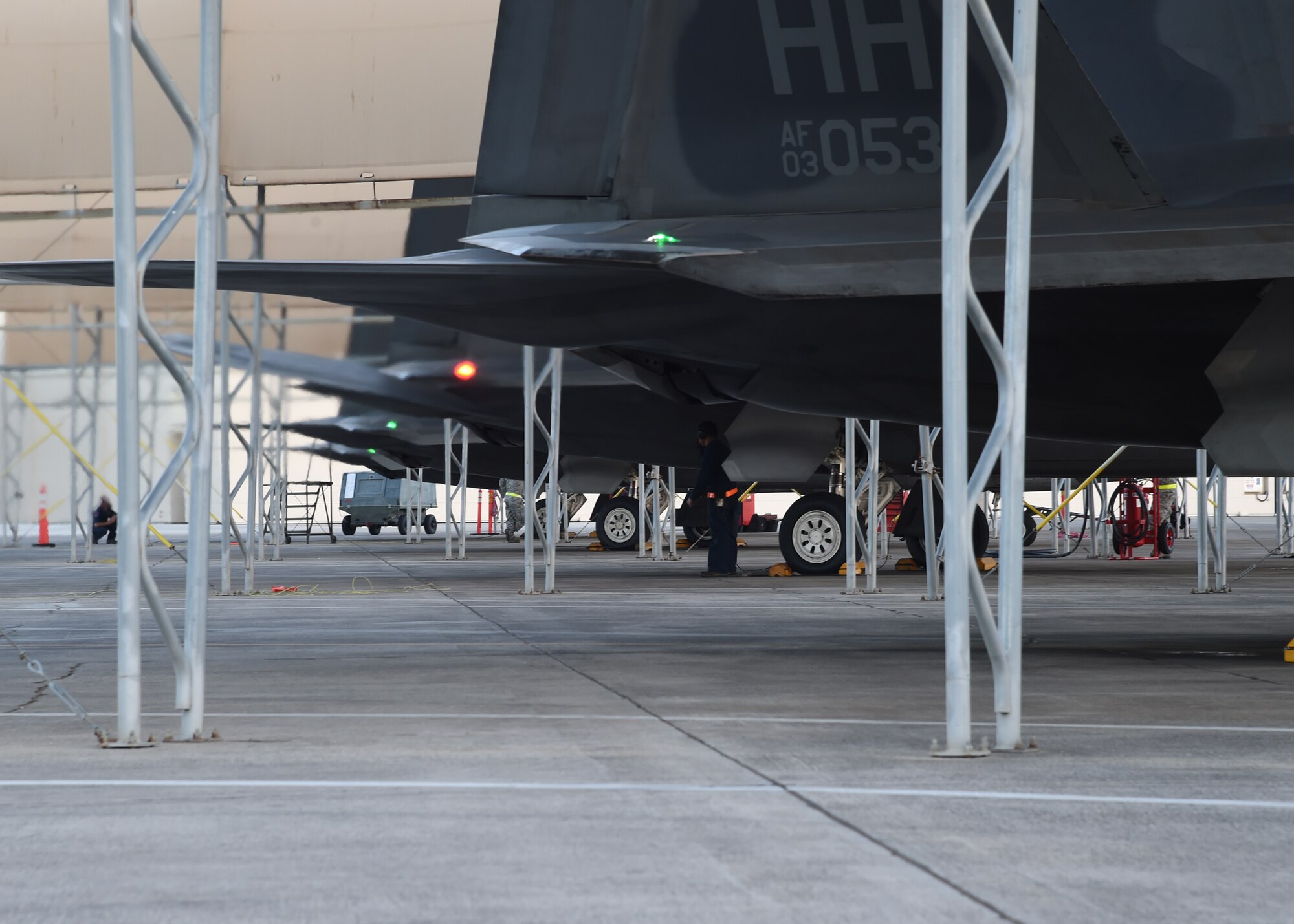 F-22 Raptors from the 199th Fighter Squadron prepare to launch for a sortie surge from Joint Base Pearl Harbor-Hickam, Hawaii, June 6, 2015. A record breaking 62 Raptor sorties were successfully launched from the runway at JBPHH.  A sortie surge, or an increase in flying operations, simulates wartime operations, which is higher than the standard training tempo. (U.S. Air Force photo by Tech. Sgt. Aaron Oelrich/Released)     