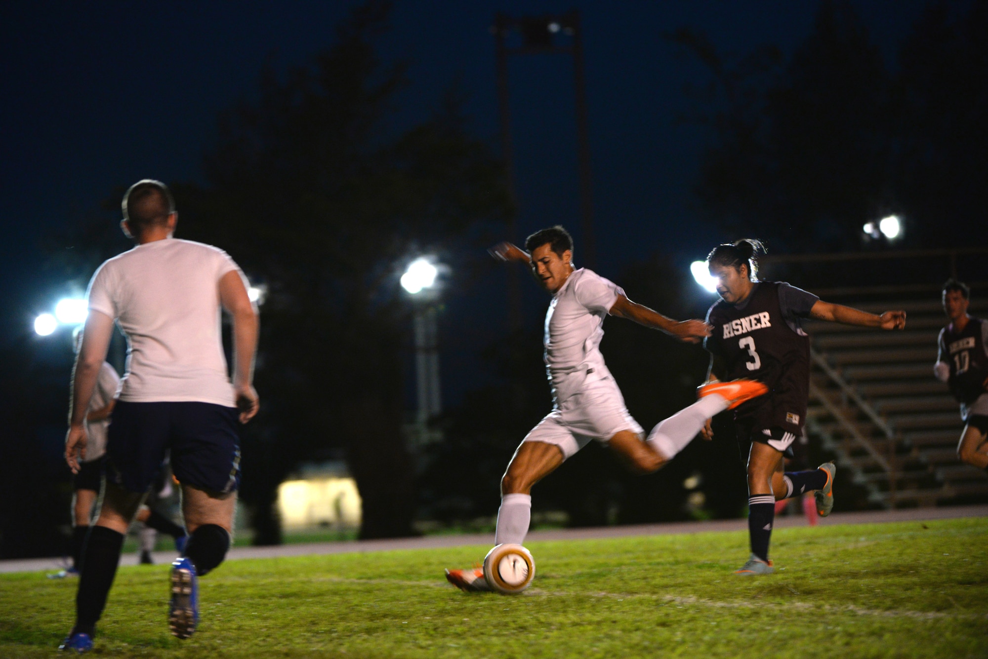 U.S. Air Force 1st Lt. Aaron Zendejas, 961st Airborne Air Control Squadron air battle manager and mid-fielder, shoots for a goal during an intramural soccer match at the Risner Fitness Center on Kadena Air Base, Japan, June 2, 2015. Zendejas played soccer for Kadena High School from 2002 to 2006 and also played for Northern Illinois University. (U.S. Air Force photo by Senior Airman Omari Bernard)