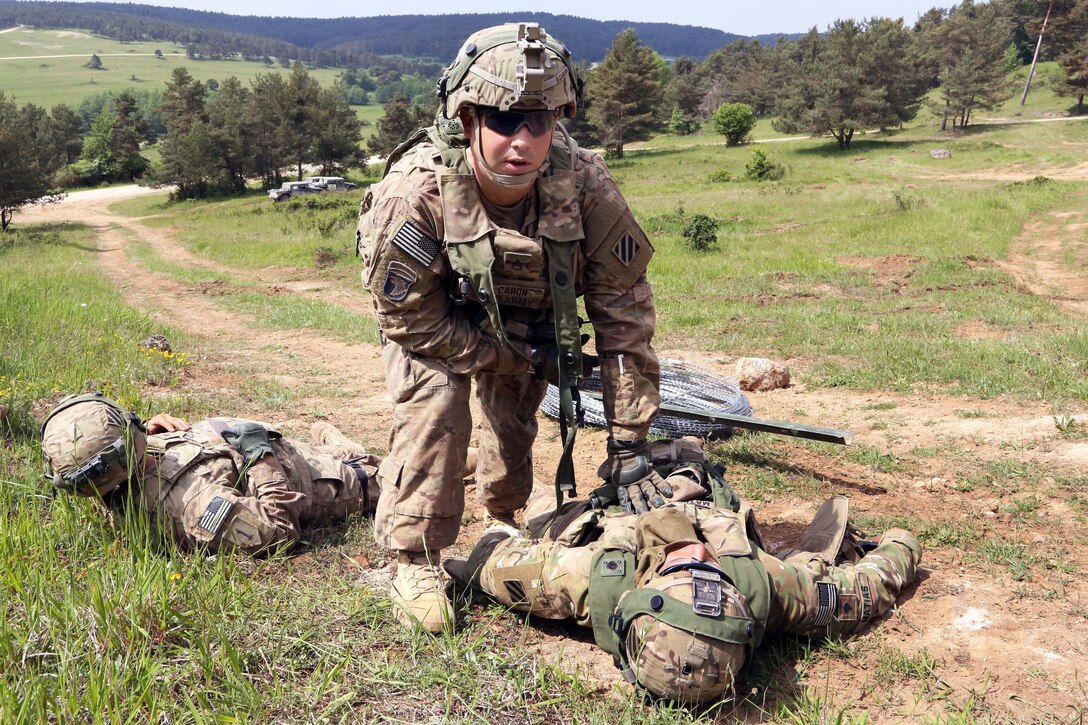 A U.S. soldier calls for medical evacuation for simulated casualties during Exercise Combined Resolve IV at the U.S. Army’s Joint Multinational Readiness Center in Hohenfels, Germany, May 28, 2015. 