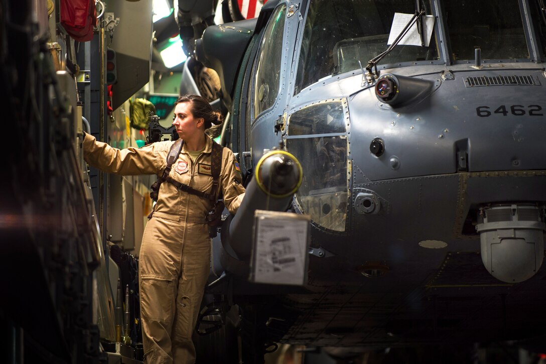 U.S. Airman 1st Class Alexa Storm lowers the ramp on a C-17 Globemaster III aircraft to offload a HH-60G Pave Hawk helicopter on Bagram Airfield, Afghanistan, May 27, 2015. Storm is a loadmaster assigned to the 8th Airlift Squadron. U.S. Air Force cargo aircraft have delivered 19,900 short tons of cargo throughout Afghanistan this year.