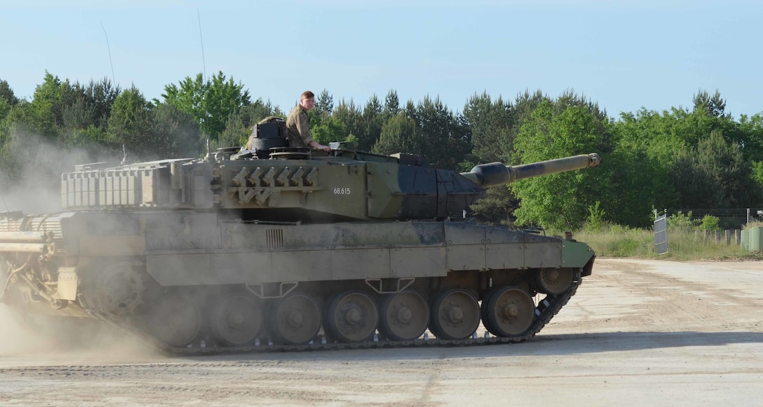 Danish soldiers drive their Leopard 2A5 main battle tank on the Drawsko ...