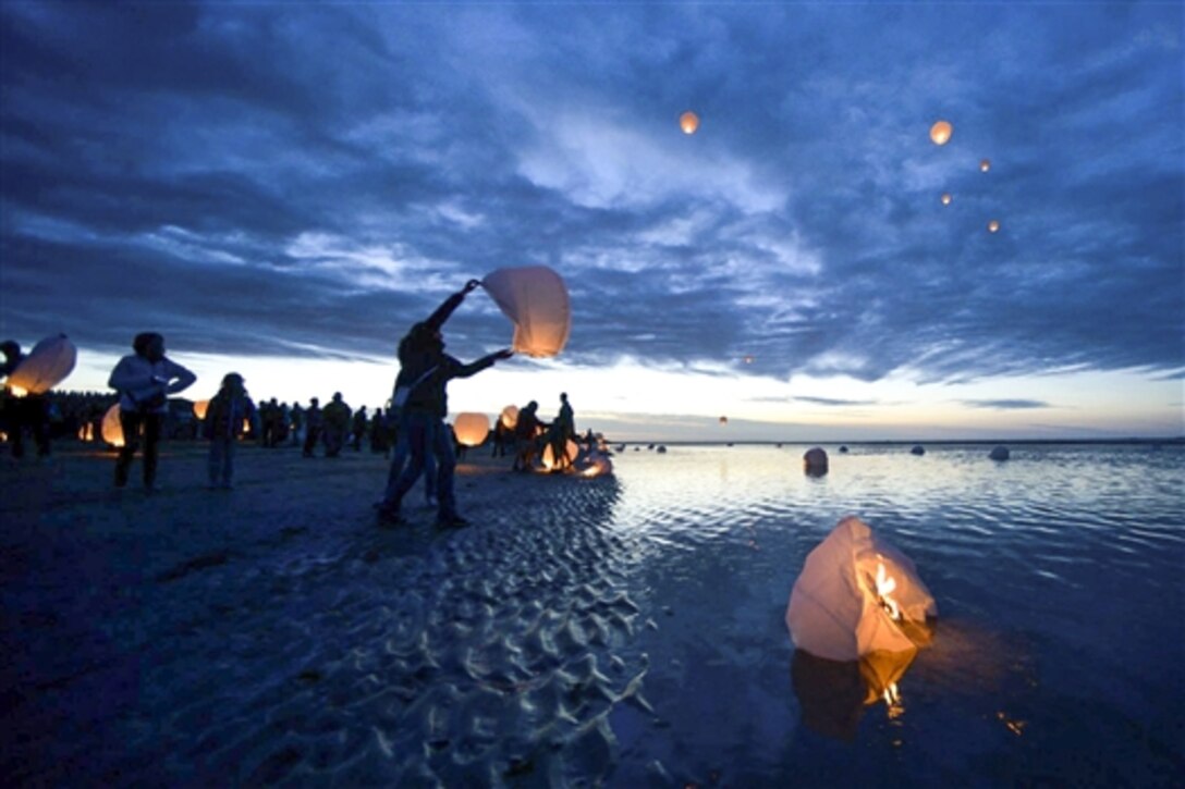 Residents of the Normandy, France, region release paper sky lanterns. June 5, 2015, to commemorate those who died during the D-Day invasion at a place the allied forces named Utah Beach. More than 380 American service members from Europe and affiliated D-Day historical units participated in D-Day events from June 2-8 as part of Joint Task Force D-Day 71.