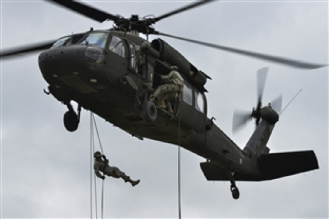 U.S. soldiers rappel from a UH-60 Black Hawk during an air assault course at the 7th Army Joint Multinational Training Command's Grafenwoehr Training Area in Bavaria, Germany, June 9, 2015.