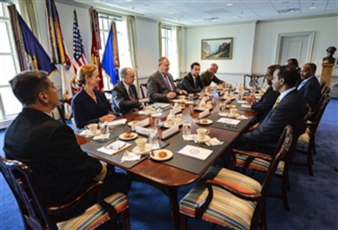 U.S. Deputy Defense Secretary Bob Work, left center, meets with Somali Prime Minister Omar Abdirashid Ali Sharmarke, right center, and Somali Defense Minister Gen. Abdulkadir Sheikh Ali Dini at the Pentagon, June 9, 2015. The leaders met to discuss issues of mutual importance.
