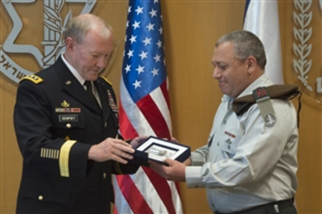 U.S. Army Gen. Martin E. Dempsey, left, chairman of the Joint Chiefs of Staff, receives the Distinguished Ally of Israeli Defense Forces award from Israeli Chief of Defense Lt. Gen. Gadi Eisenkot in Tel Aviv, Israel, June 9, 2015.  