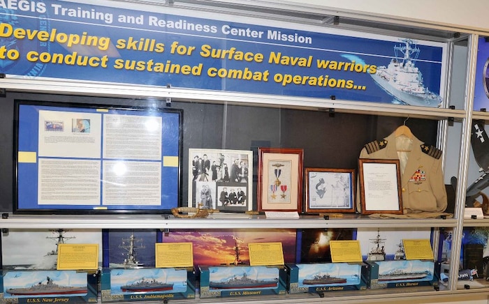 The Center for Surface Combat Systems and AEGIS Training and Readiness Center, co-located aboard Naval Support Facility Dahlgren, kick off their commemoration of the 73rd anniversary of the Battle of Midway by exhibiting World War II artifacts, including items directly related to the June 4-7, 1942 battle that changed the course of the war in the Pacific. This is the third year that Udo Goff – a defense contractor and retired Navy commander - displayed his personal collection at Dahlgren in commemoration of the Battle of Midway. Exhibit items include: U.S. Navy officer swords, ship recognition models, an aviator flight cap and radio headset, various uniforms, and the battle flag of the USS Ray (SS-271). Japanese artifacts on display include a Samurai sword, a Japanese naval officer’s dagger, and military helmets. Goff also displayed artifacts in commemoration of the Normandy D-Day invasion at a Naval Surface Warfare Center Dahlgren Division building. 