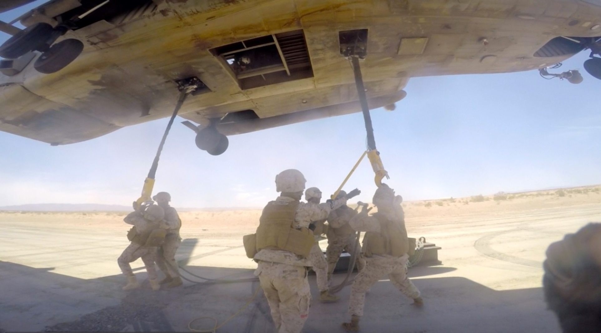 CLB-7 Landing Support Platoon Sergeant, Sgt Kenneth Sullivan instruct United Arab Emirates' Logisticians on utilizing hand and arm signals in the Outside Director position on a Helicopter Support Team.