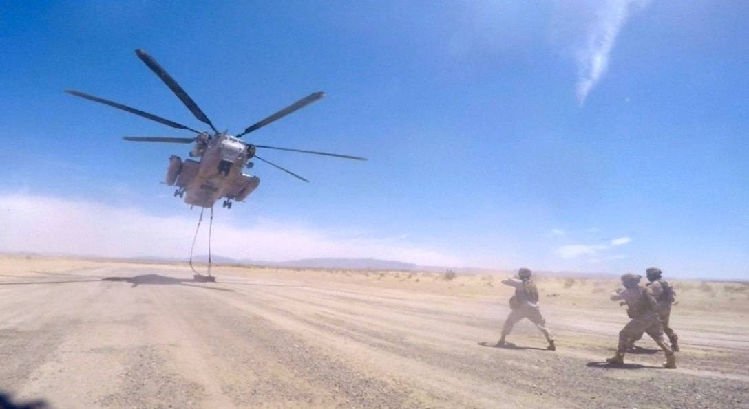 CLB-7 Landing Support Marines; Cpl Matthew Mottishaw, Chaplain Cpl James Heres, Sgt Kenneth Sullivan, Cpl Alfredo Limon, and 1stLt Tiffany Aguiar instruct the United Arab Emirates Presidential Guard on external lift operations.