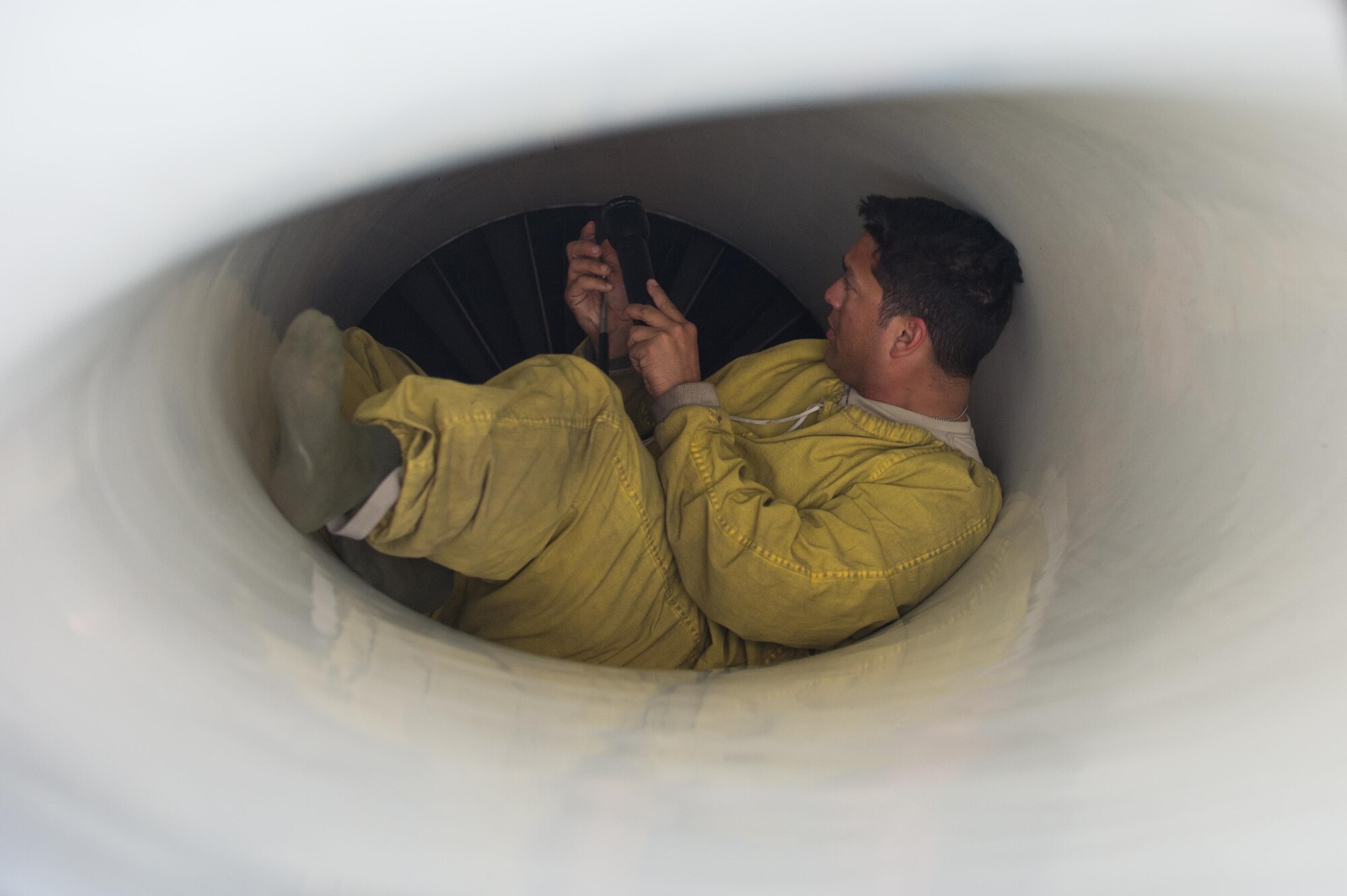 U.S. Air Force Staff Sgt. Guillermo Cruz Rodriguez, 455th Expeditionary Aircraft Maintenance Squadron, inspects the intake of an F-16 Fighting Falcon aircraft during a post flight inspection at Bagram Airfield, Afghanistan, June 8, 2015. The 455th EAMXS ensure Fighting Falcons on Bagram are prepared for flight and return them to a mission-ready state once they land.  (U.S. Air Force photo by Tech. Sgt. Joseph Swafford/Released)