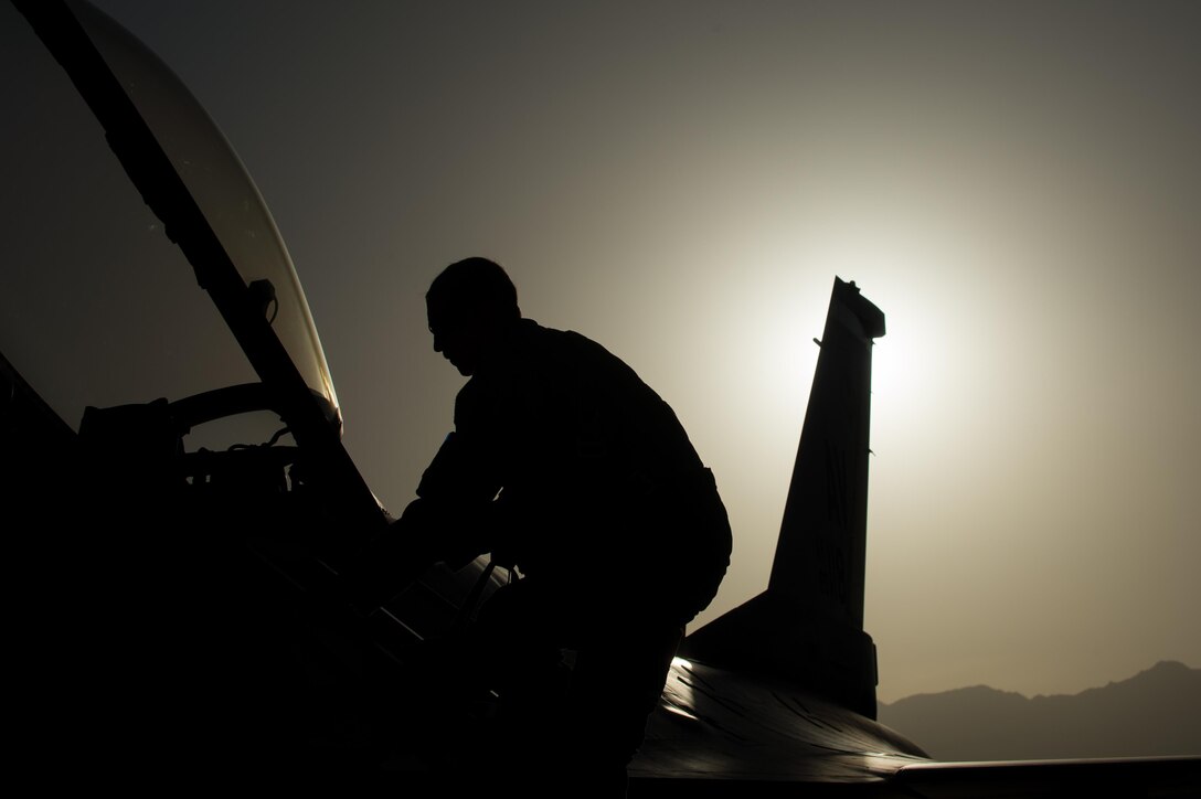 U.S. Air Force Senior Airman Joseph Santana, 455th Expeditionary Aircraft Maintenance Squadron crew chief, completes an F-16 Fighting Falcon aircraft post flight inspection at Bagram Airfield, Afghanistan, June 8, 2015. The 455th EAMXS ensure Fighting Falcons on Bagram are prepared for flight and return them to a mission-ready state once they land.  (U.S. Air Force photo by Tech. Sgt. Joseph Swafford/Released)