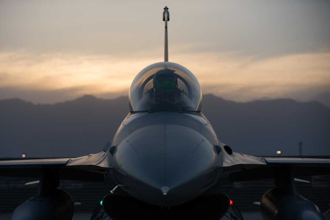 U.S. Air Force Capt. Doug Mayo, 555th Expeditionary Fighter Squadron F-16 Fighting Falcon aircraft pilot, goes through preflight inspection with Staff Sgt. William Harris, 455th Expeditionary Maintenance Squadron crew chief, before a combat sortie at Bagram Airfield, Afghanistan, June 8, 2015. The 455th EAMXS ensure Fighting Falcons on Bagram are prepared for flight and return them to a mission-ready state once they land.  (U.S. Air Force photo by Tech. Sgt. Joseph Swafford/Released)