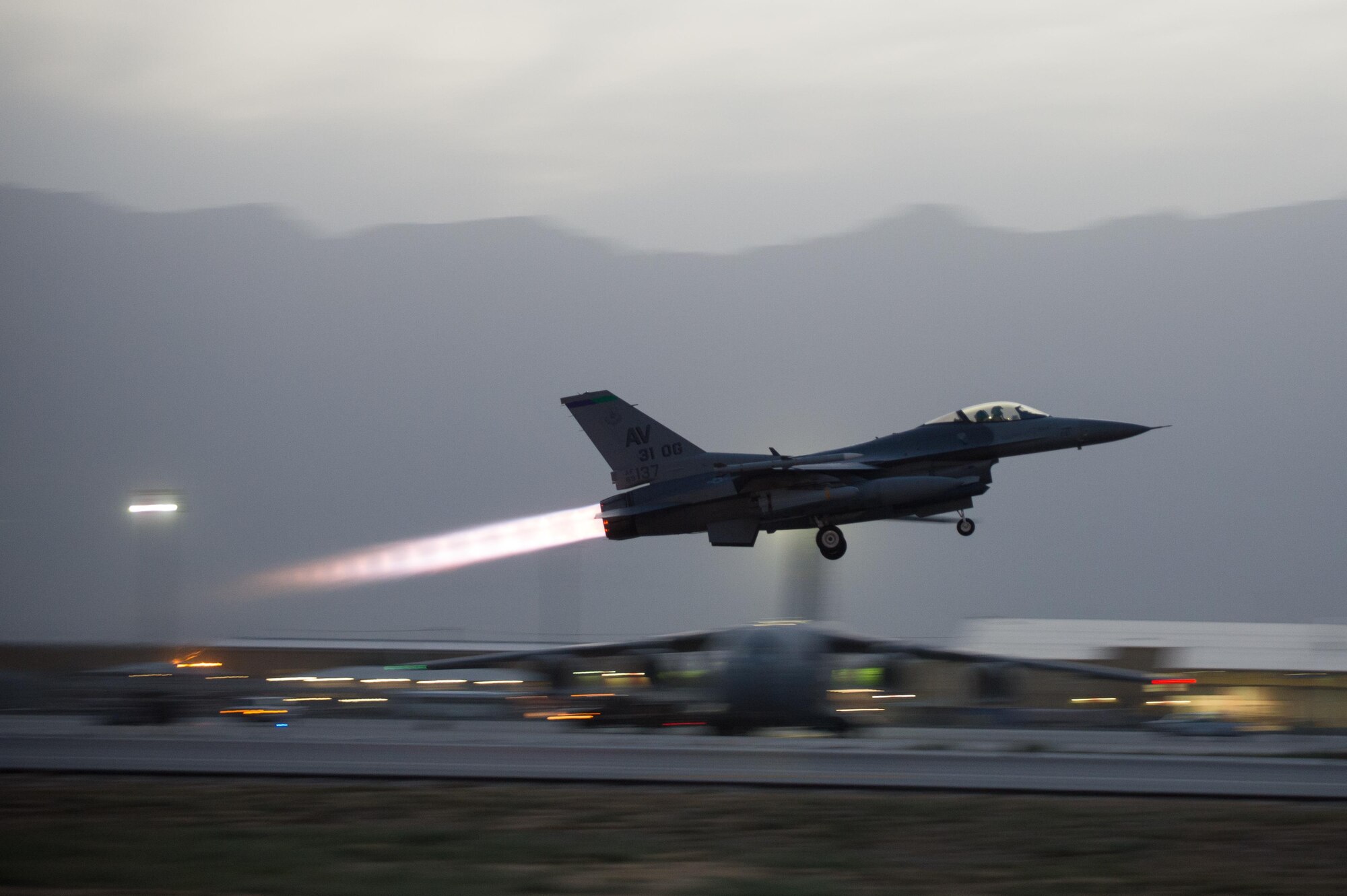 U.S. Air Force Capt. Doug Mayo, 555th Expeditionary Fighter Squadron, pilots an F-16 Fighting Falcon aircraft during takeoff from Bagram Airfield, Afghanistan, June 8, 2015. Before takeoff Staff Sgt. William Harris, 455th Expeditionary Maintenance Squadron crew chief, performed a preflight inspection on the aircraft to ensure it was ready to fly the combat sortie.  (U.S. Air Force photo by Tech. Sgt. Joseph Swafford/Released)