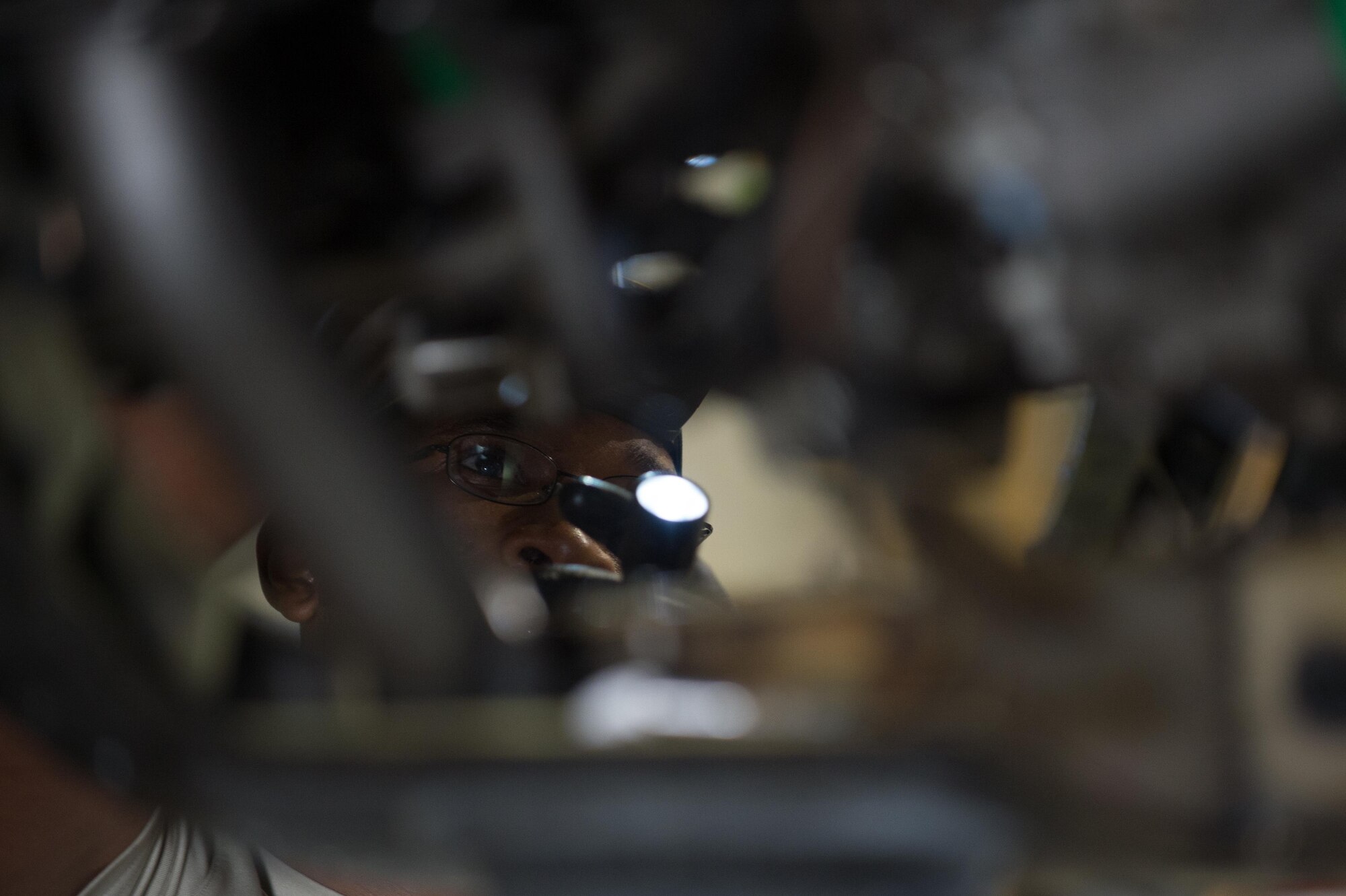 U.S. Air Force Staff Sgt. Donterrio Erby, 455th Expeditionary Maintenance Squadron, performs a 400-hour engine inspection on an F-16 Fighting Falcon aircraft at Bagram Airfield, Afghanistan, June 9, 2015. The 455th EAMXS ensure Fighting Falcons on Bagram are prepared for flight and return them to a mission-ready state once they land.  (U.S. Air Force photo by Tech. Sgt. Joseph Swafford/Released)