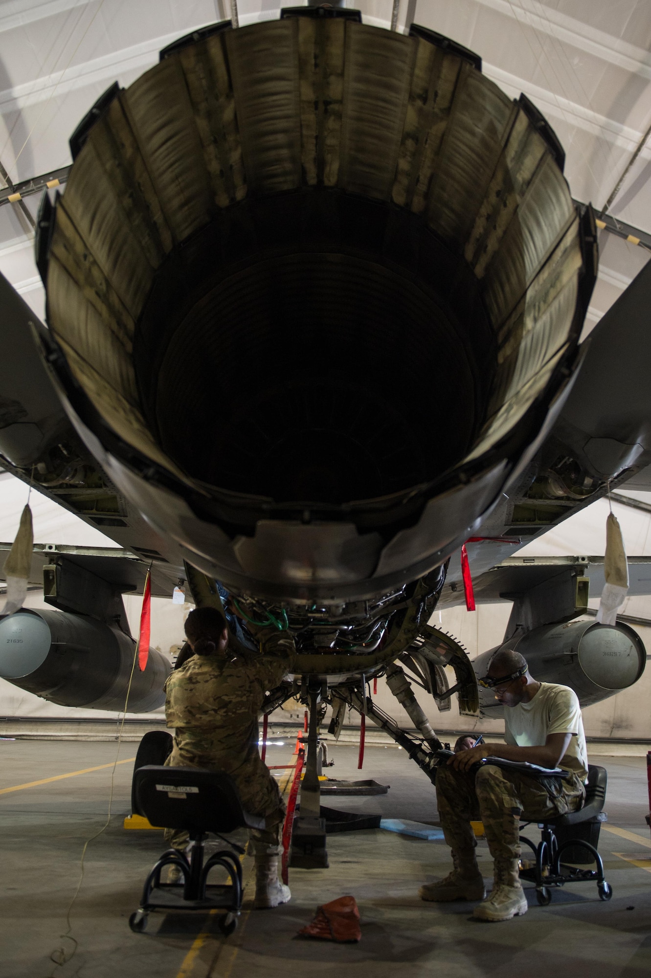 U.S. Air Force Staff Sgt. Donterrio Erby and Senior Airman Jaid Downing, both assigned to the 455th Expeditionary Maintenance Squadron, perform a 400-hour engine inspection on an F-16 Fighting Falcon aircraft at Bagram Airfield, Afghanistan, June 9, 2015. The 455th EAMXS ensure Fighting Falcons on Bagram are prepared for flight and return them to a mission-ready state once they land.  (U.S. Air Force photo by Tech. Sgt. Joseph Swafford/Released)