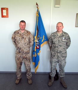 U.S. Air Force Master Sgt. Thomas Frutos stands with Latvian Maj. Vilnis Metlans following Frutos’ award of the Latvian National Armed Forces Air Force Commander Award of Honor, Grade 3, in Lielvarde, Latvia, April 30, 2015. Frutos is assigned to the 217th Air Operations Group, Michigan Air National Guard, based at Battle Creek, Mich., and is the first U.S. Armed Forces member to receive the Latvian award. He was recognized for his expertise in airspace management, which resulted in a letter of agreement between the Latvian Civil Aviation Authority and the Latvian military creating military training airspace. 
