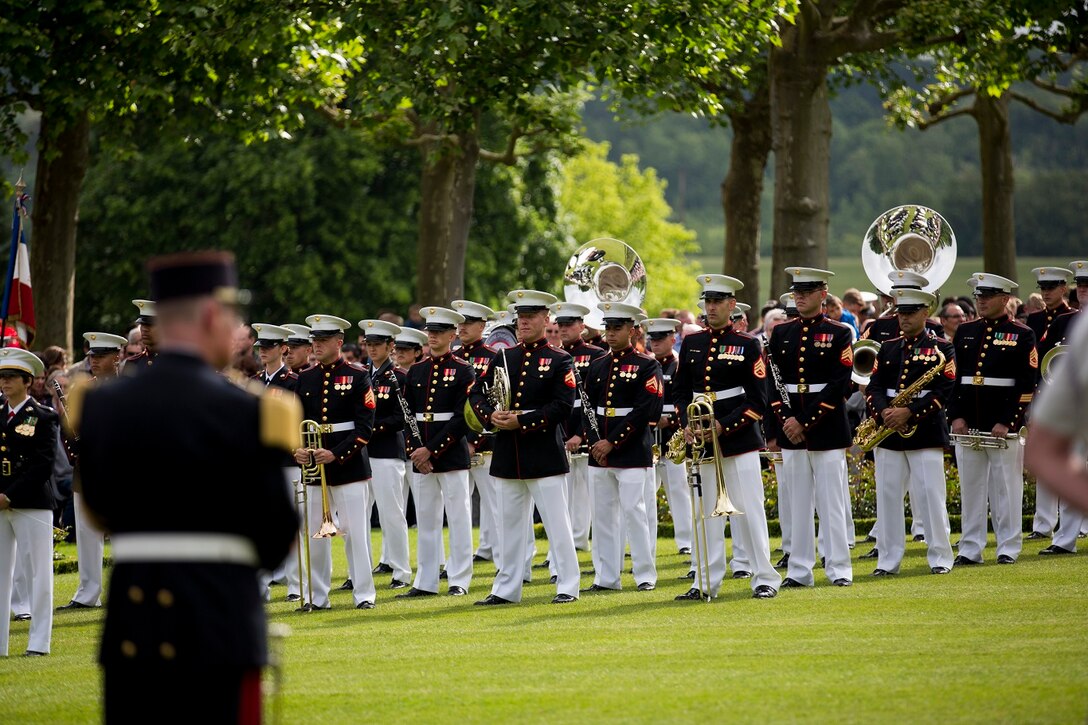 U.S. Marines with the 1st Marine Division Band participate in an anniversary ceremony with the French Legionnaires on Aisne Marne American Cemetery in Belleau, France, on May 31, 2015. The ceremony was held to commemorate the Battle of Belleau Wood. (U.S. Marine Corps Photo by Sgt. Luis A. Vega/Released)