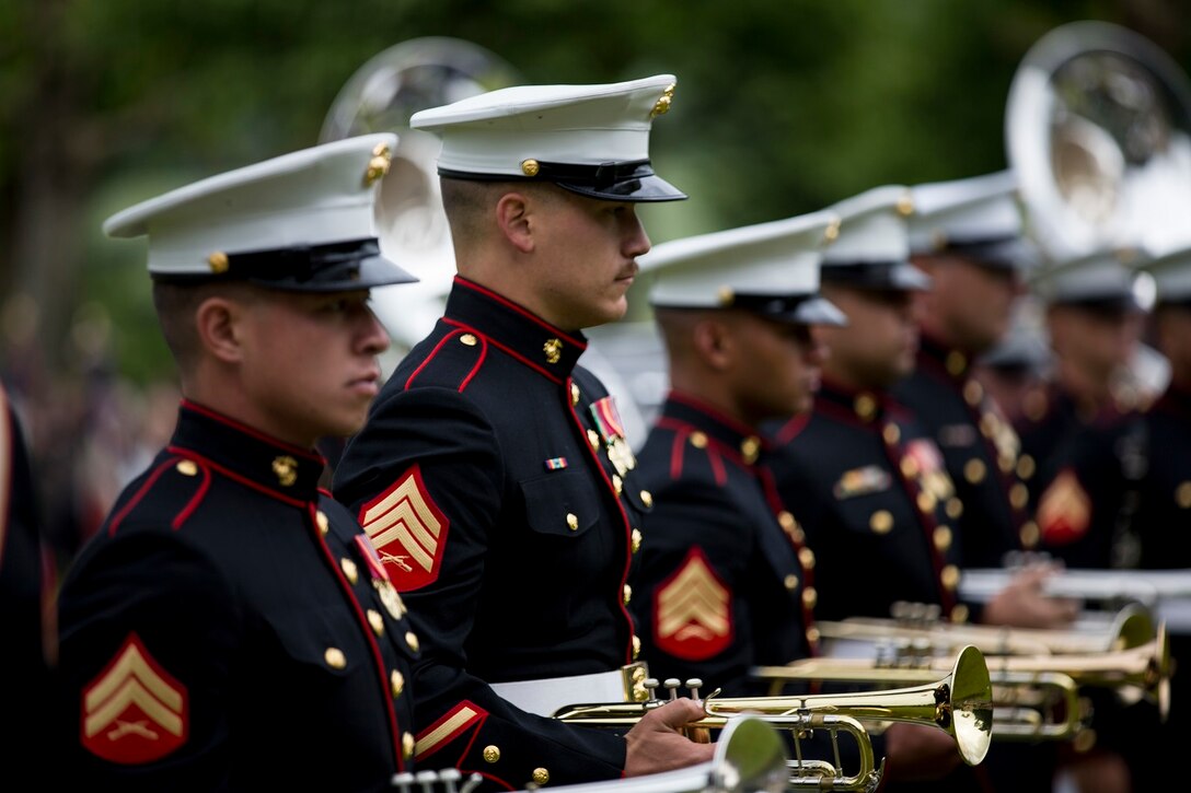 U.S. Marines with the 1st Marine Division Band participate in an anniversary ceremony with the French Legionnaires on Aisne Marne American Cemetery in Belleau, France, on May 31, 2015. The ceremony was held to commemorate the Battle of Belleau Wood. (U.S. Marine Corps Photo by Sgt. Luis A. Vega/Released)