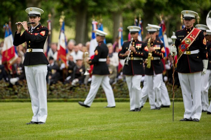 U.S. Marine Corps Mollie Juberien, a piccolo player with the 1st Marine Division Band, plays a solo during an anniversary ceremony with the French Legionnaires on Aisne Marne American Cemetery in Belleau, France, on May 31, 2015. The ceremony was held to commemorate the Battle of Belleau Wood. (U.S. Marine Corps Photo by Sgt. Luis A. Vega/Released)