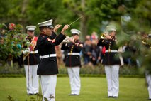 U.S. Marine Corps GySgt. Tracy Martinez, a Enlisted Conductor with the 1st Marine Division Band, conducts the band during an anniversary ceremony with the French Legionnaires on Aisne Marne American Cemetery in Belleau, France, on May 31, 2015. The ceremony was held to commemorate the Battle of Belleau Wood. (U.S. Marine Corps Photo by Sgt. Luis A. Vega/Released)