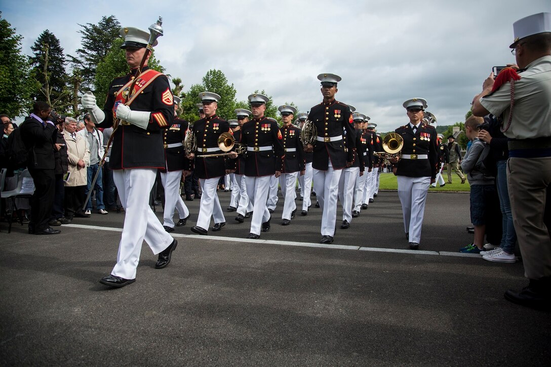 U.S. Marines with the 1st Marine Division Band march off the field during an anniversary ceremony with the French Legionnaires on Aisne Marne American Cemetery in Belleau, France, on May 31, 2015. The ceremony was held to commemorate the Battle of Belleau Wood. (U.S. Marine Corps Photo by Sgt. Luis A. Vega/Released)