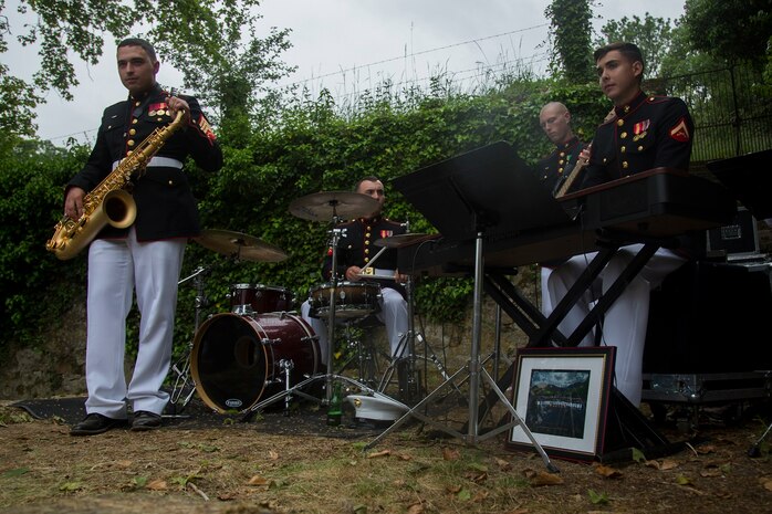 U.S. Marines with the 1st Marine Division Combo Band perform after an anniversary ceremony with the French Legionnaires on Aisne Marne American Cemetery in Belleau, France, on May 31, 2015. The ceremony was held to commemorate the Battle of Belleau Wood. (U.S. Marine Corps Photo by Sgt. Luis A. Vega/Released)