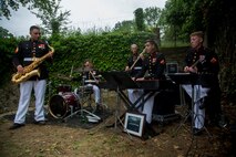 U.S. Marines with the 1st Marine Division Combo Band perform after an anniversary ceremony with the French Legionnaires on Aisne Marne American Cemetery in Belleau, France, on May 31, 2015. The ceremony was held to commemorate the Battle of Belleau Wood. (U.S. Marine Corps Photo by Sgt. Luis A. Vega/Released)