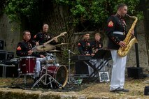 U.S. Marines with the 1st Marine Division Combo Band perform after an anniversary ceremony with the French Legionnaires on Aisne Marne American Cemetery in Belleau, France, on May 31, 2015. The ceremony was held to commemorate the Battle of Belleau Wood. (U.S. Marine Corps Photo by Sgt. Luis A. Vega/Released)