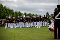 U.S. Marines with the 1st Marine Division Band participate in an anniversary ceremony with the French Legionnaires on Aisne Marne American Cemetery in Belleau, France, on May 31, 2015. The ceremony was held to commemorate the Battle of Belleau Wood. (U.S. Marine Corps Photo by Sgt. Luis A. Vega/Released)