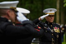 General John M. Paxton, Jr. Assistant Commandant of the Marine Corps salutes while Taps is played, during a private ceremony at Aisne-Marne American Cemetery in Belleau, France, on May 31, 2015. This Memorial Day ceremony was held in honor of the 97th anniversary of the Battle of Belleau Wood. (U.S. Marine Corps photo by Lance Cpl. Akeel Austin/Released)